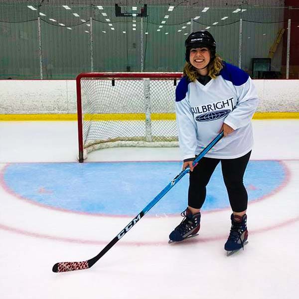 Ellen Korcovelos playing ice hockey