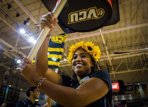 Student holding flag at VCU's Siegel Center