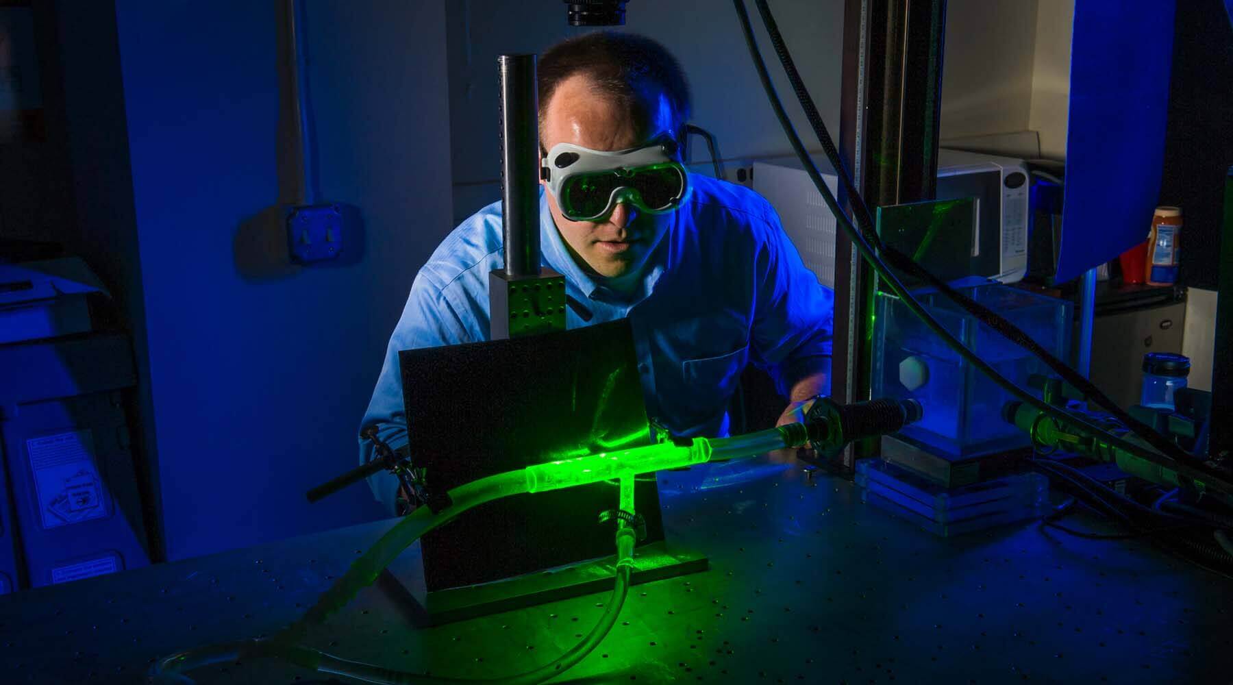 Researcher wearing goggles in lab